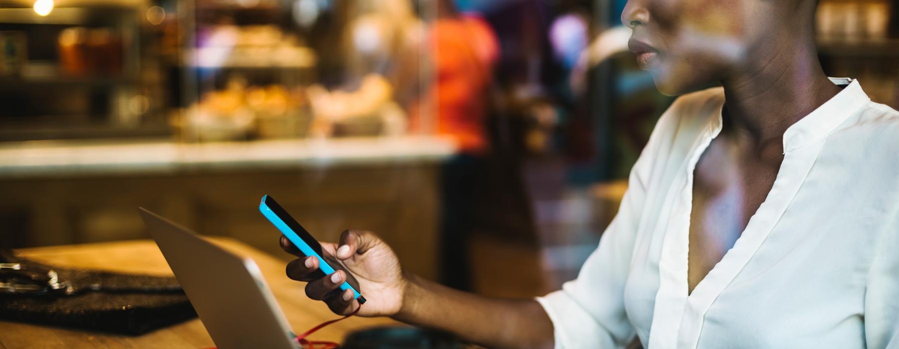 a woman looking at a cell phone