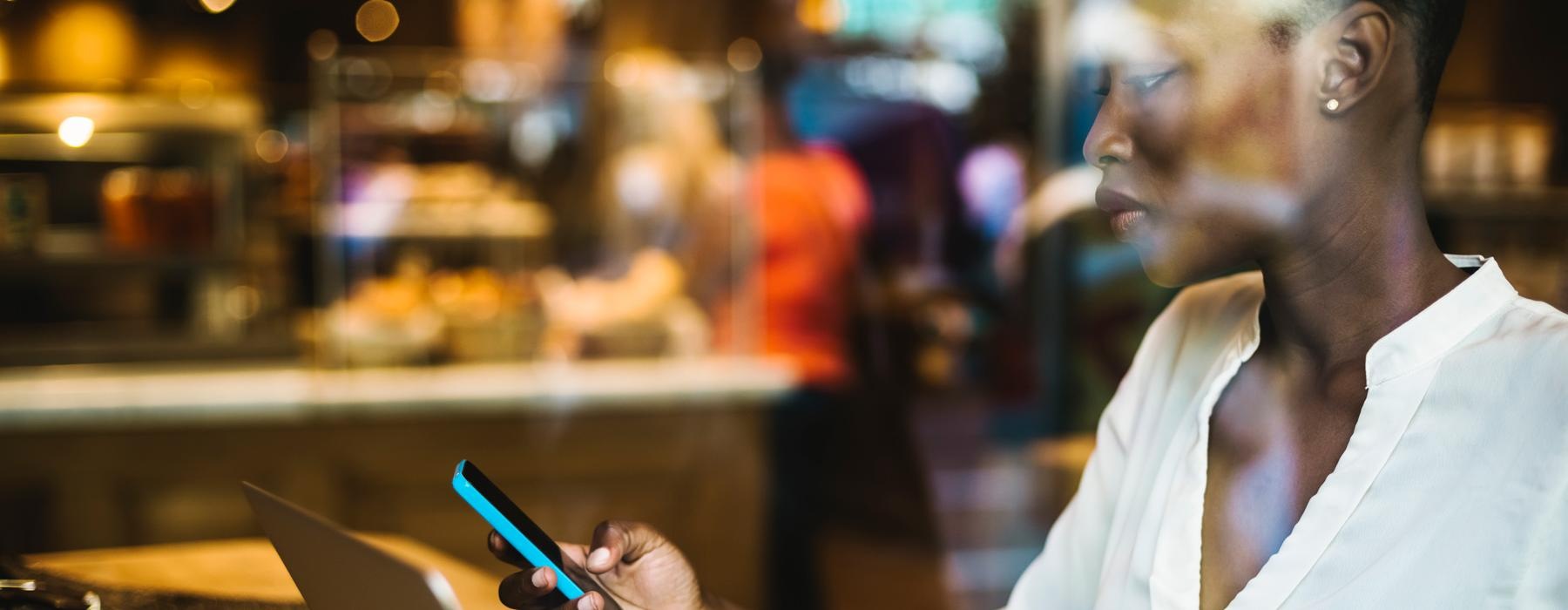 a woman looking at a cell phone